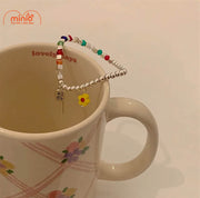 Lắc tay hạt cướm charm hoa cúc