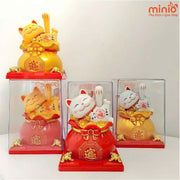 Mèo thần tài hũ vàng vẫy tay