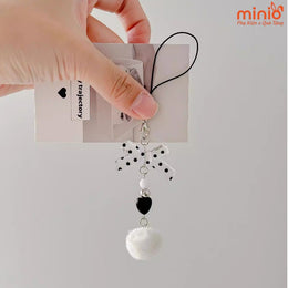 Móc khóa nơ chấm bi cục bông