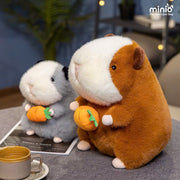 Chuột Hamster ôm cà rốt nhỡ