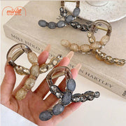 Kẹp càng cua chéo đính đá 074 UX