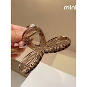 Kẹp càng cua nơ cánh tròn