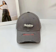 Nón kết thêu chữ Thingking rách TBL