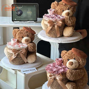 Gấu Teddy đội mũ nồi ôm hoa