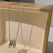 Dây chuyền 2 nhẫn titan