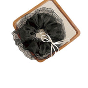 Scrunchies von ren đen trắng đính nơ ML