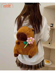 Balo bông Capybara ôm hoa