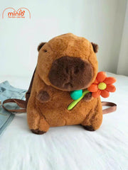 Balo bông Capybara ôm hoa