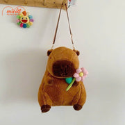Balo bông Capybara ôm hoa