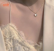 Dây chuyên nơ ngọc trong tim