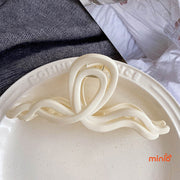 Kẹp càng cua nơ sóng