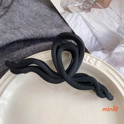 Kẹp càng cua nơ sóng