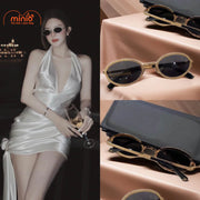 Kính mát gọng oval viền nhũ