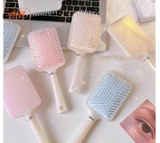 Lược massage nhũ oval