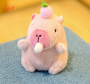 Móc khoá bông Capybara hồng thổi bóng