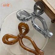 Kẹp càng cua nơ nhựa