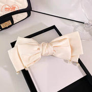 Kẹp tóc nơ tua hạt ngọc