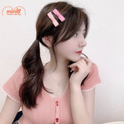 Vỉ 2 kẹp mái nơ tim hồng