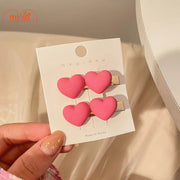 Vỉ 2 kẹp mái nơ tim hồng