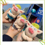 Móc khóa bông heo tóc xanh