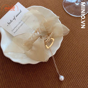 Kẹp càng cua kim loại nơ ngọc trai