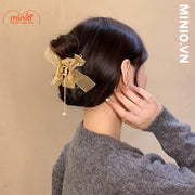 Kẹp càng cua kim loại nơ ngọc trai