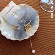 Kẹp càng cua kim loại nơ ngọc trai