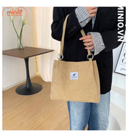 Túi tote nhung tăm chiếc lá móc kim loại