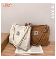 Túi tote nhung tăm chiếc lá móc kim loại