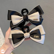 Kẹp càng cua nơ vải Min