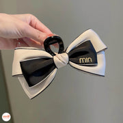 Kẹp càng cua nơ vải Min