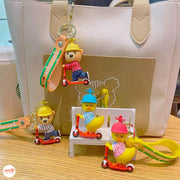 Móc khoá thú chạy xe