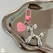 Móc khóa cún tim hồng