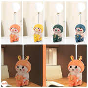 Đèn bàn heo đi xe