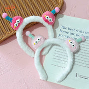 Cài tóc 2 bé 2 mắt tóc xoăn