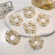 Cột tóc lò xo 5 hạt trai