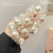 Cột tóc lò xo 5 hạt trai